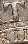 I centered under left side of stem of T 1827 capped bust half dollar
